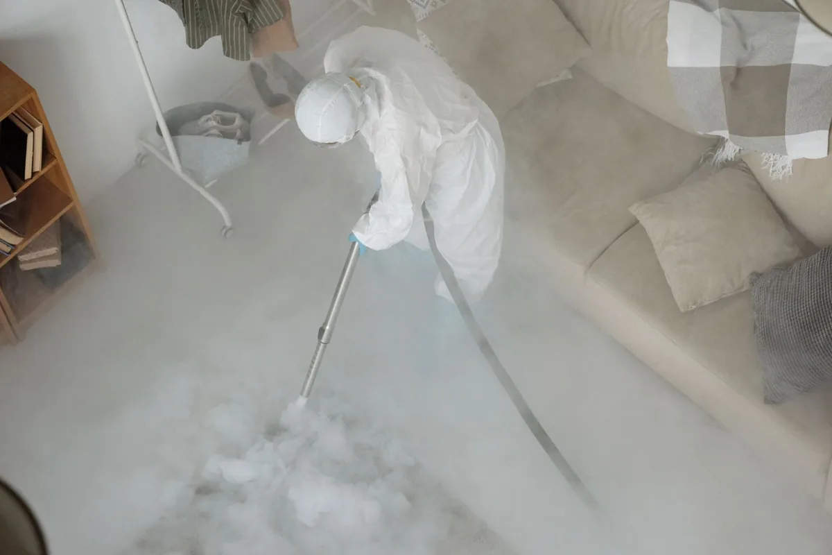 Biohazard cleanup technician in protective equipment, Chisago City, MN